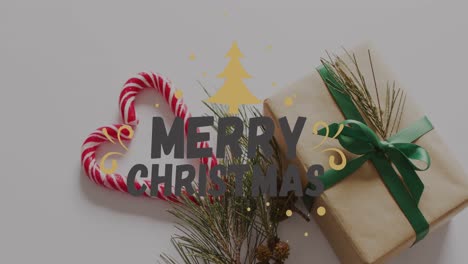 animación de saludos de navidad texto sobre regalos y decoraciones de navidad.