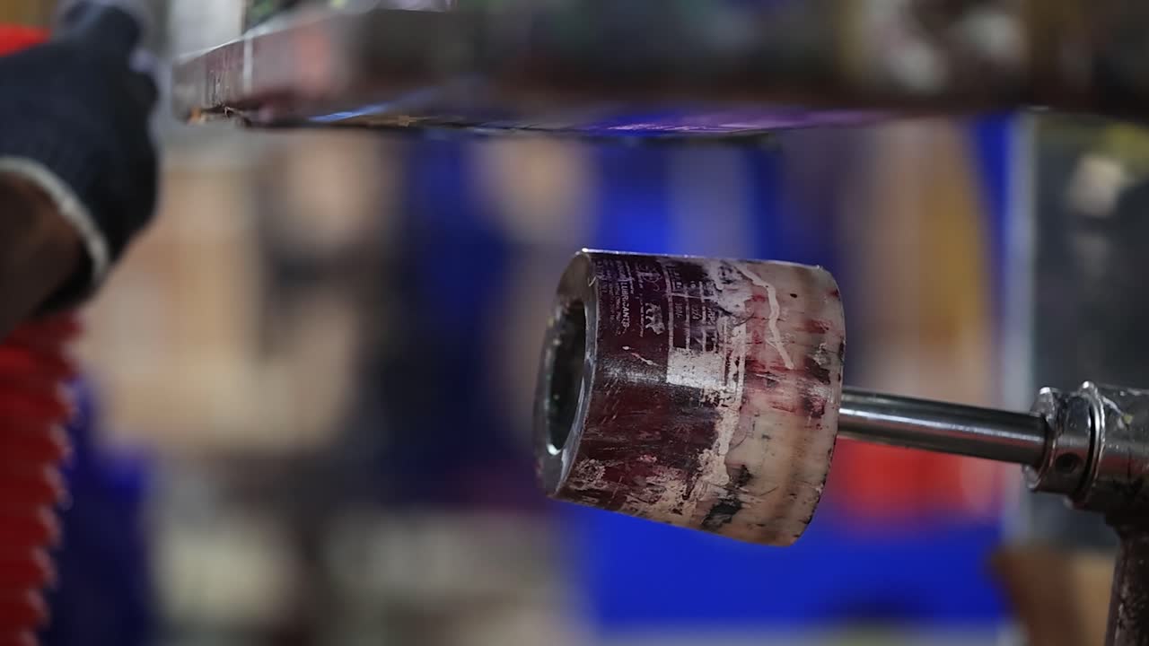 slow motion seen of man hold a Grease bowl of offset printing, industry 5.0