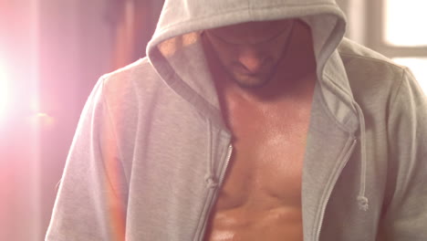 fit man wearing hooded jumper