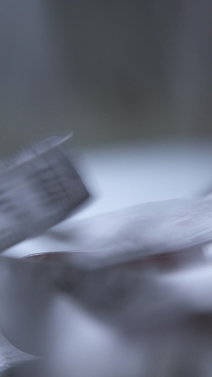 CU: Professional designer puts white tape measure on green cushion board at equipment in workshop extreme close view