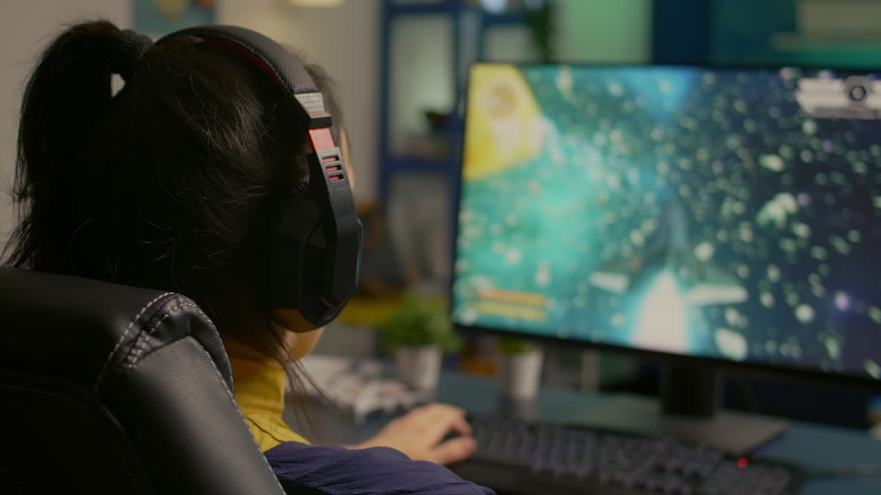 Close-up of gamer sitting on gaming chair