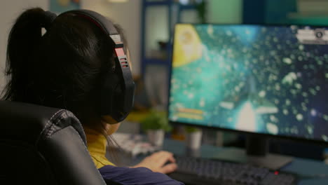 close-up of gamer sitting on gaming chair