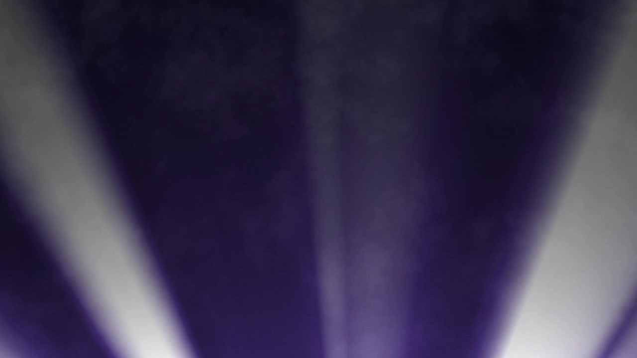 Bright White Light Beams Shining Through Dark Purple Haze