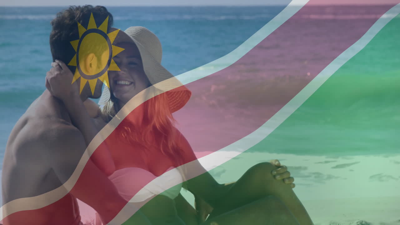 Relaxing on beach, couple with Namibia flag animation overlaying scene