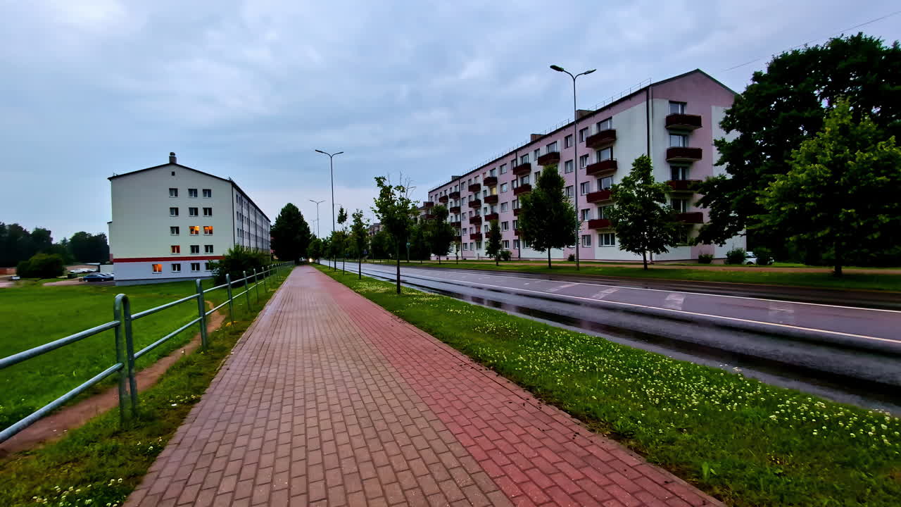 A Brickstone Pathway With Buildings In The Background In Valmiera, Latvia. Wide Shot
