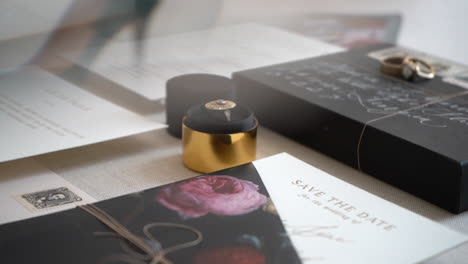 displaying save the day cards, stationary, wedding invitations, rings and other special keepsakes from a wedding