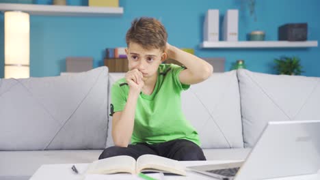 Thoughtful-and-confused-little-boy-at-home.