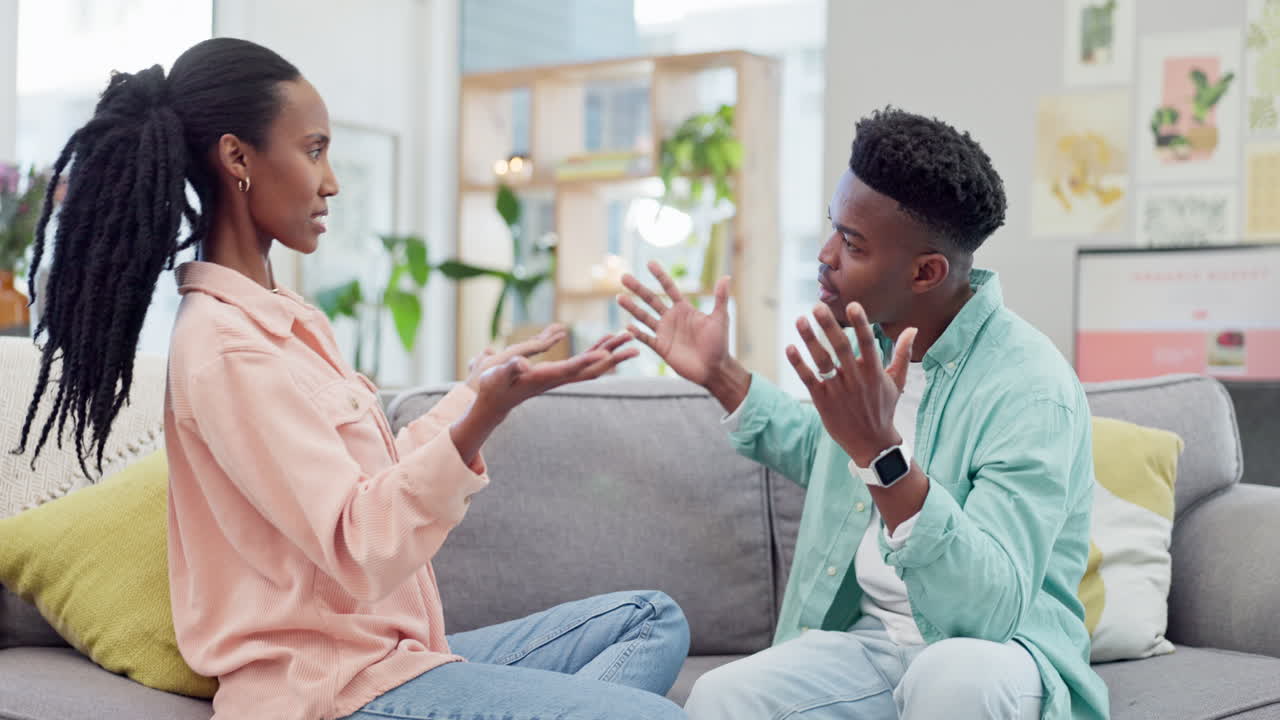Angry, fight and black couple on a living room