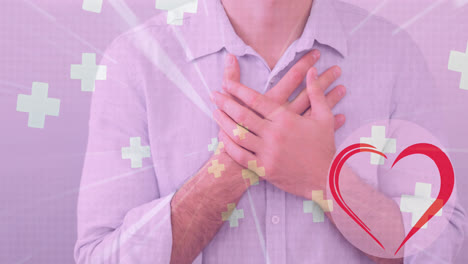 animation of heart and crosses icons over caucasian man holding his chest