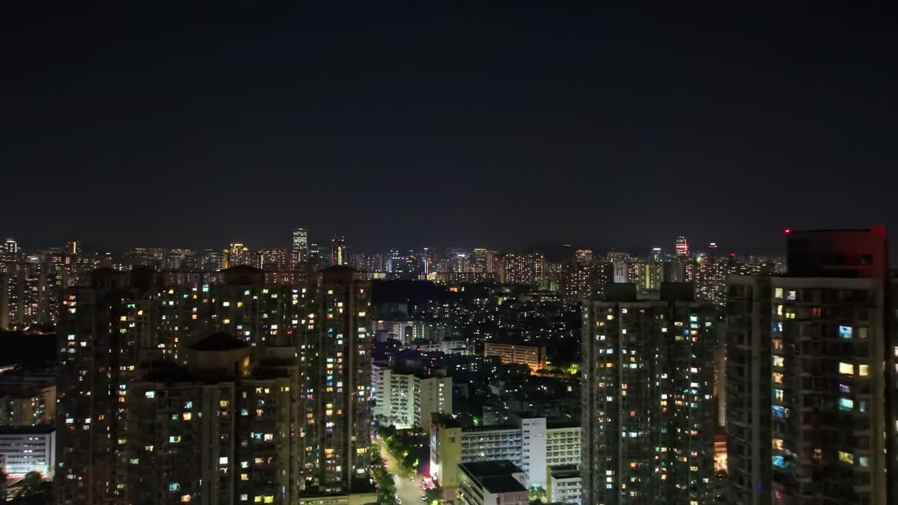 Captivating Cityscape at Night: A Dazzling Display of Urban Lights and Buildings in a Vibrant Skyline with Twinkling Lights and Architectural Elegance