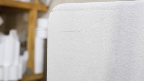 close-up of precision cut on white polystyrene foam material in factory