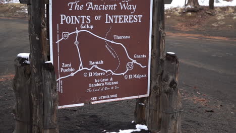 Sign-and-Map-of-Scenic-Route-53,-The-Ancient-Way-Point-of-Interest,-Ice-Cave-and-Bandera-Volcano,-New-Mexico-USA,-Tilt-Up