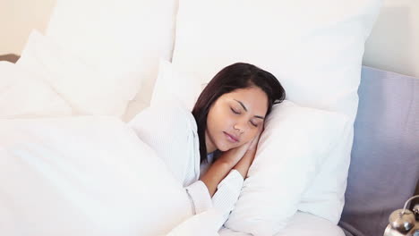 woman woken by her alarm clock