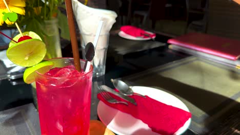 vibrant drink with garnishes on a table