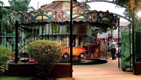 an old carousel or merry-go-round in a public square in buenos aires, argentina. 4k resolution.