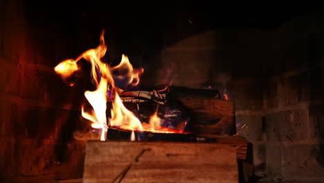 warm cozy fire in fireplace. close up firewood coal in the fireplace