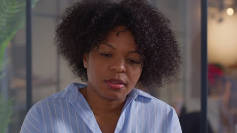 close up of worried woman being given bad news on test results by doctor or oncologist at meeting in treatment clinic for breast cancer in hospital