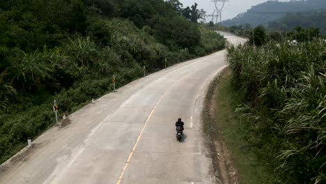 motorcycle riding on a mountain road