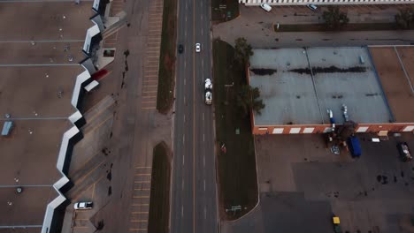 Following-towing-truck-from-the-air-in-the-industrial-area