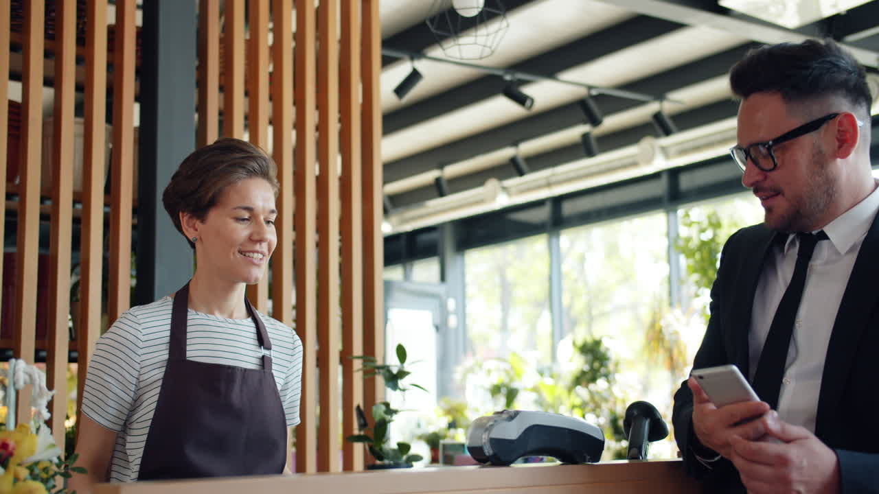 Customer paying for flowers at a flower shop