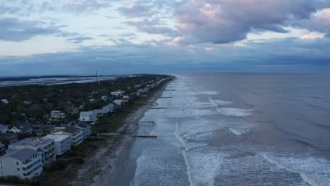 Aerial-wide-rising-shot-of-Folly-Island-in-South-Carolina-at-sunset