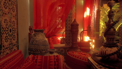 a cozy and luxurious moroccan living room with traditional decor and a hookah