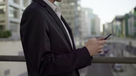 side view of caucasian male hands texting on tablet, swiping