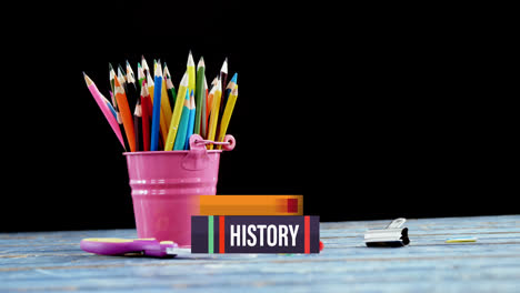 Stack-of-books-icons-against-school-equipment-on-wooden-table