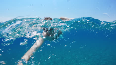 man training swim in the ocean