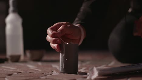 lighting a candle at night