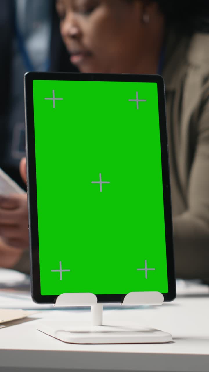 Vertical Video Diverse engineering team sharing expertise with isolated screen in solar plant