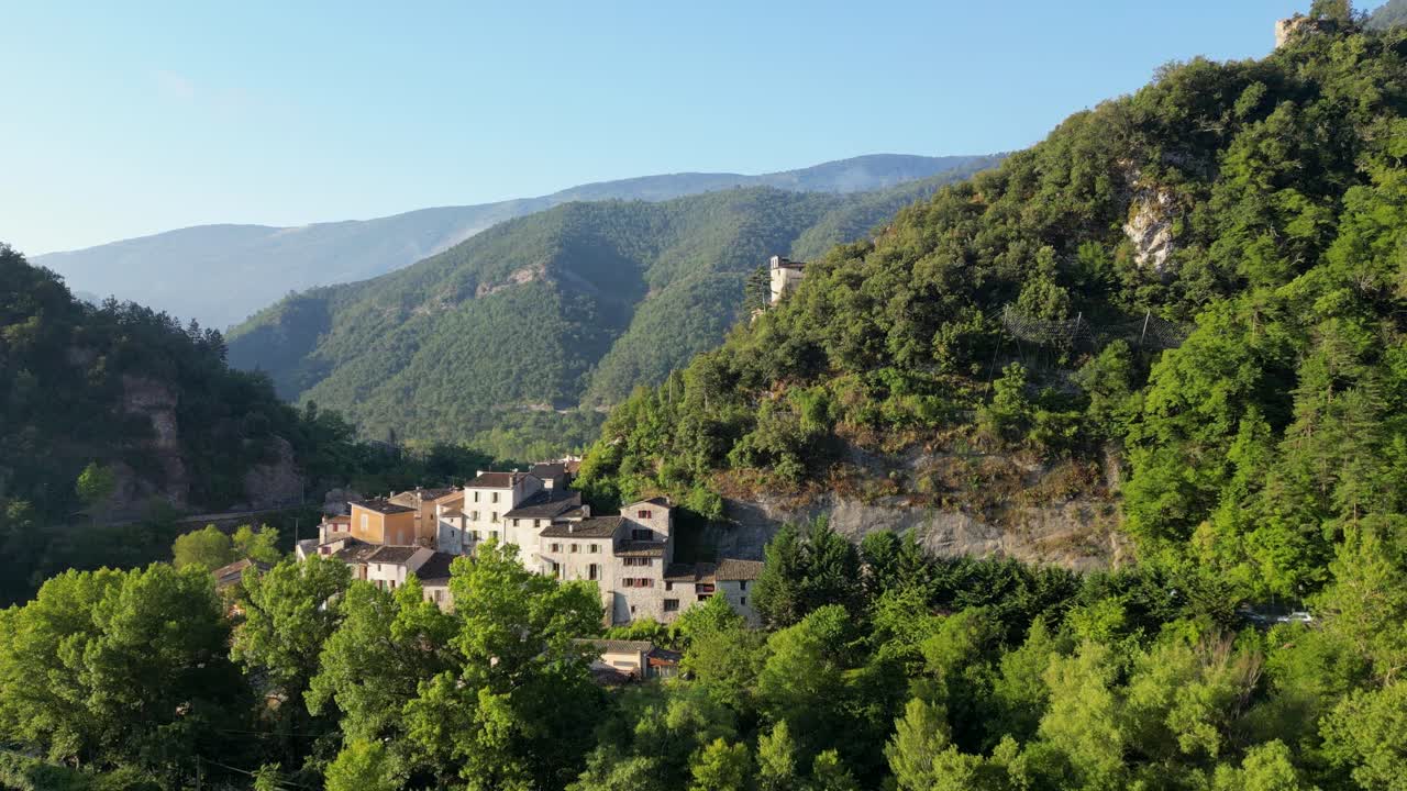 Upward drone shot moving over a serene village, showcasing the natural beauty of the south of France.