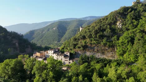 upward drone shot moving over a serene village, showcasing the natural beauty of the south of france.