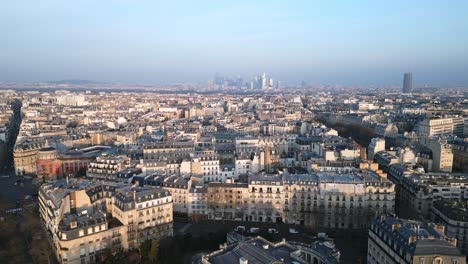 Paris-in-the-morning-with-La-Defense-skyscrapers-and-Montparnasse-tower-in-background,-France