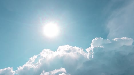 bright sun light ray n sunbeam with fluffy white cloud on cyan blue sky