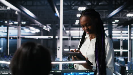 technicians in high tech data center cooperate on neural network software