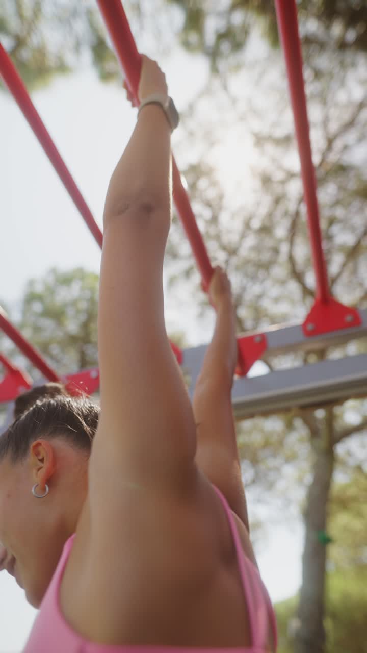 Woman Exercising on Outdoor Monkey Bars
