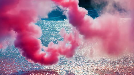 pink smoke over water