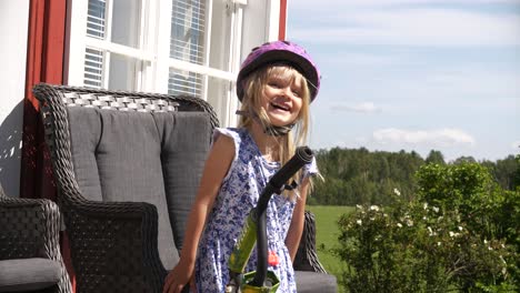 happy smiling little girl with bike helmet on head