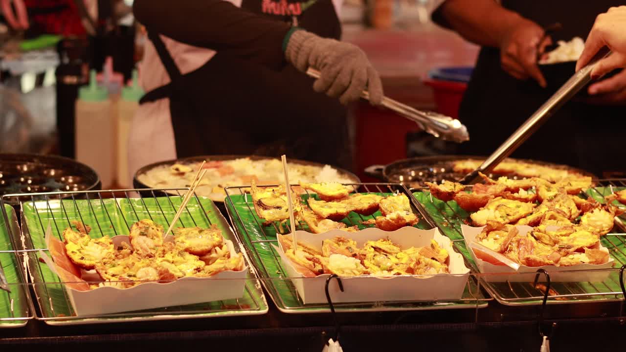 Vendors grill skewers at a bustling market stall, highlighting vibrant street food culture with lively interactions and warm lighting