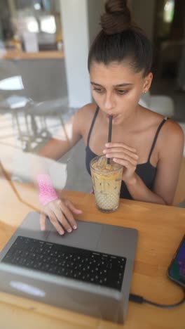 young woman working in a cafe