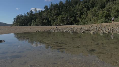 Shallow-Clear-Water-On-Rocky-Shore-Of-Sawmill-Beach---Waterhole-On-Seashore-Of-Beach-At-Whitsunday-Island,-QLD,-Australia