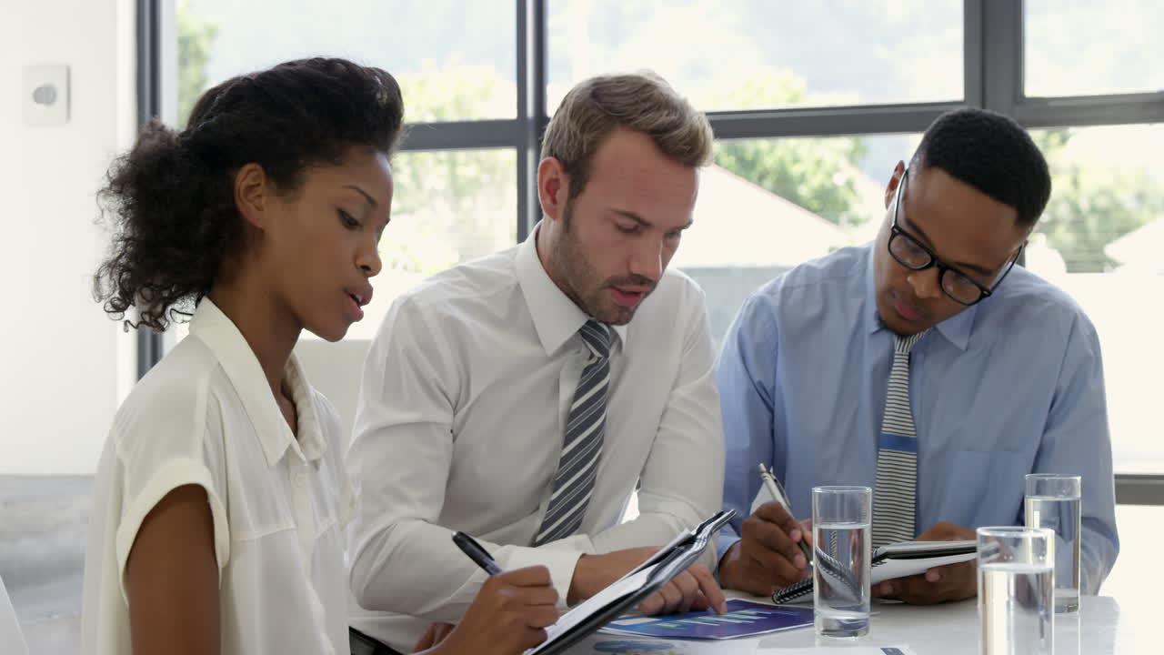 Businesspeople working together around a table