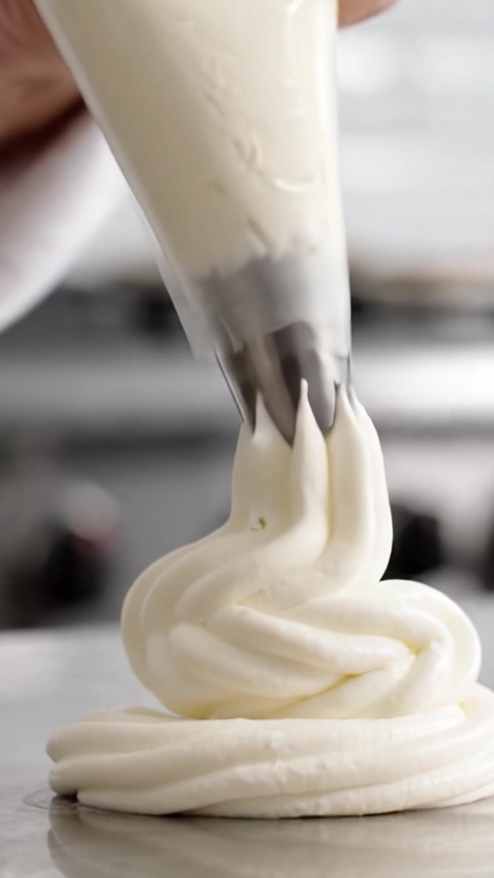 A Step-by-Step Process of Creating Beautiful Whipped Cream Swirls: From Piping to Decoration, Capturing the Art of Dessert Presentation