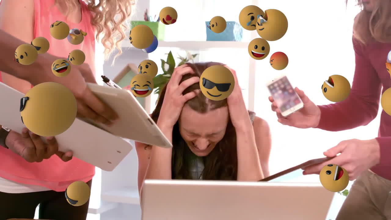 Emoji icons with a woman using laptop in the background