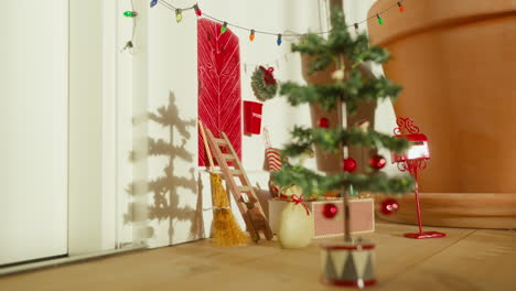 nordic holiday charm with elf door and christmas tree shadow