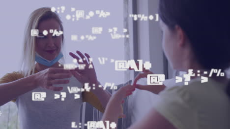 animation of data processing over smiling caucasian woman and her daughter using sign language