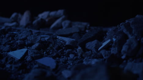 Thunderstorm-with-heavy-Lightning-Raining-on-rocks-and-debris-close-up-slider