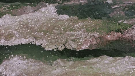 Cinematic-close-up-shot-of-Ganges-river-crystal-clear-water-flowing-downstream-from-mountains-in-harshal-village-of-uttarakhand