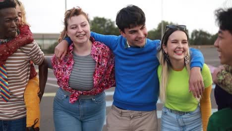 young diverse people having fun outdoor laughing together